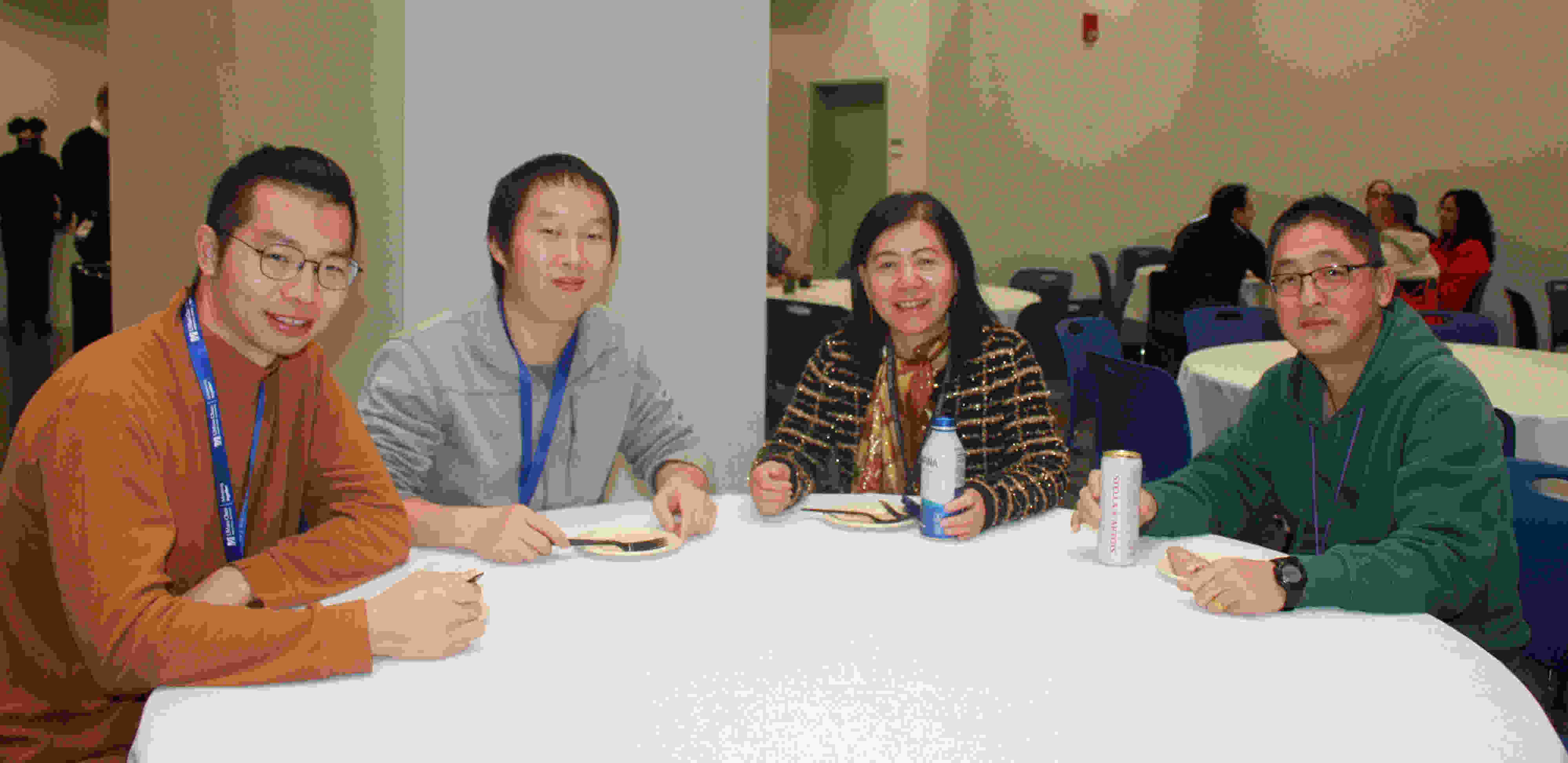Neurology department team members at table 
