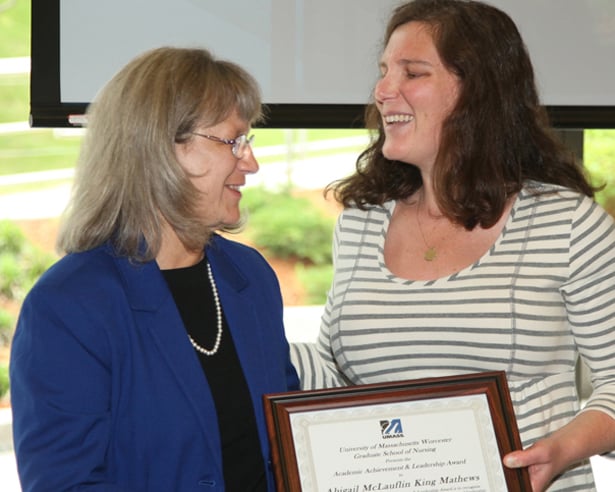 Abigail Mathews receives the Academic Achievement and Leadership Award from GSN Dean Paulette Seymour Route.