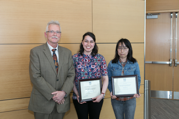 Dean Carruthers stands with Hatem Elif Kamber Kaya and Yihang Li, recipients of Dean’s Award for Outstanding Thesis Research.