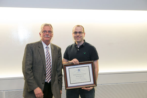 Dr. Carruthers and Faculty Award recipient Brendan Hilbert, PhD
