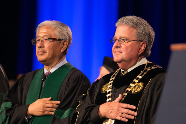 Keynote speaker Victor Dzau, MD and University of Massachusetts President Robert Caret during the national anthem.