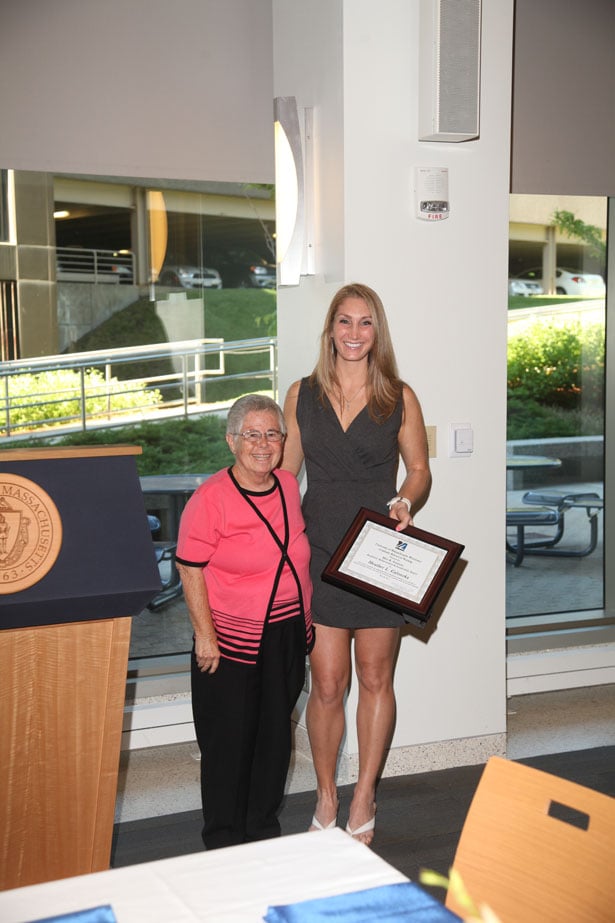 Professor emeritus Mary Kay Alexander presents the academic achievement and leadership award named for her to Heather Galonzka.