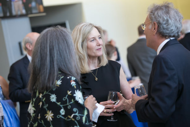 Vice Provost Luanne Thorndyke, MD, center, chats with Tina Miller and Andrew Miller, MD.