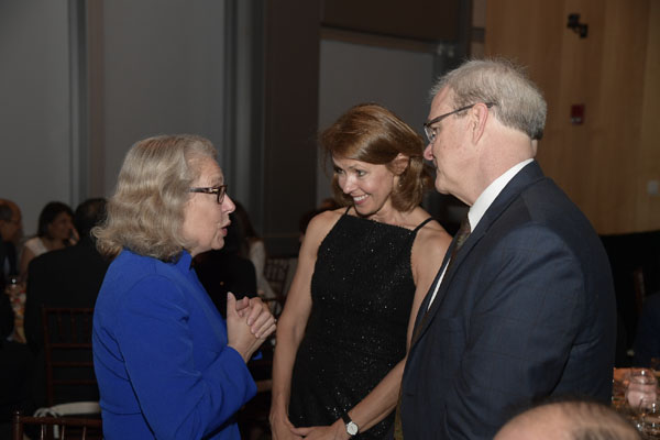 Claire Pomeroy with Professor of Medicine Gyongi Szabo, MD, PhD, and Dean Flotte.