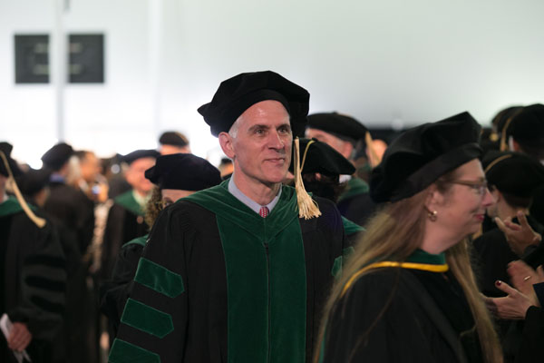 David Hatem, MD, marches in the processional.