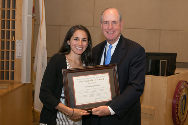 Chancellor Michael F. Collins presents the Chancellor’s Award to Gianna Wilkie.