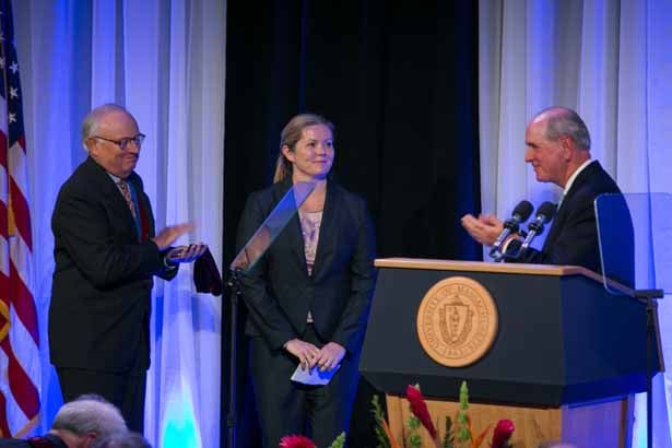 Thoru Pederson, PhD, left, helps Chancellor Collins invest Kate Fitzgerald, PhD, as the Worcester Foundation Chair in Biomedical Research.