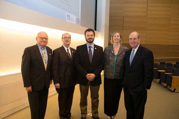 From left, Thoru Pederson, PhD; Dean Terence Flotte, MD; Marc Freeman, PhD; Mary Munson, PhD; and Chancellor Michael Collins.