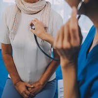 Doctor listening to a patient's heart