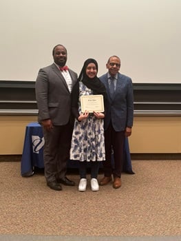 Najla Khan displays the Assistant Dean's Special Recognition Award