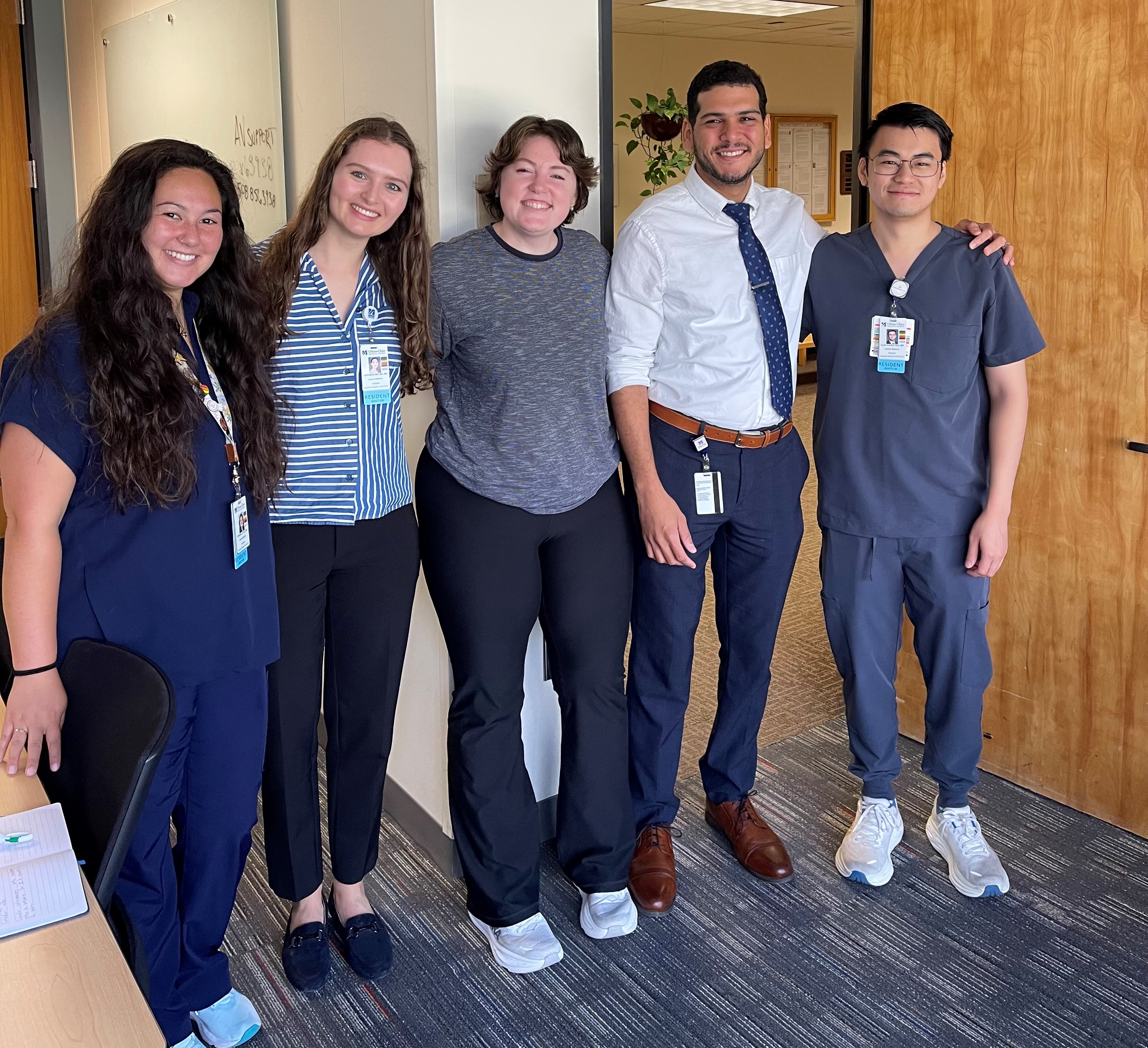 Dr. Victor Acosta-Rivera posing with Primary Care Residents