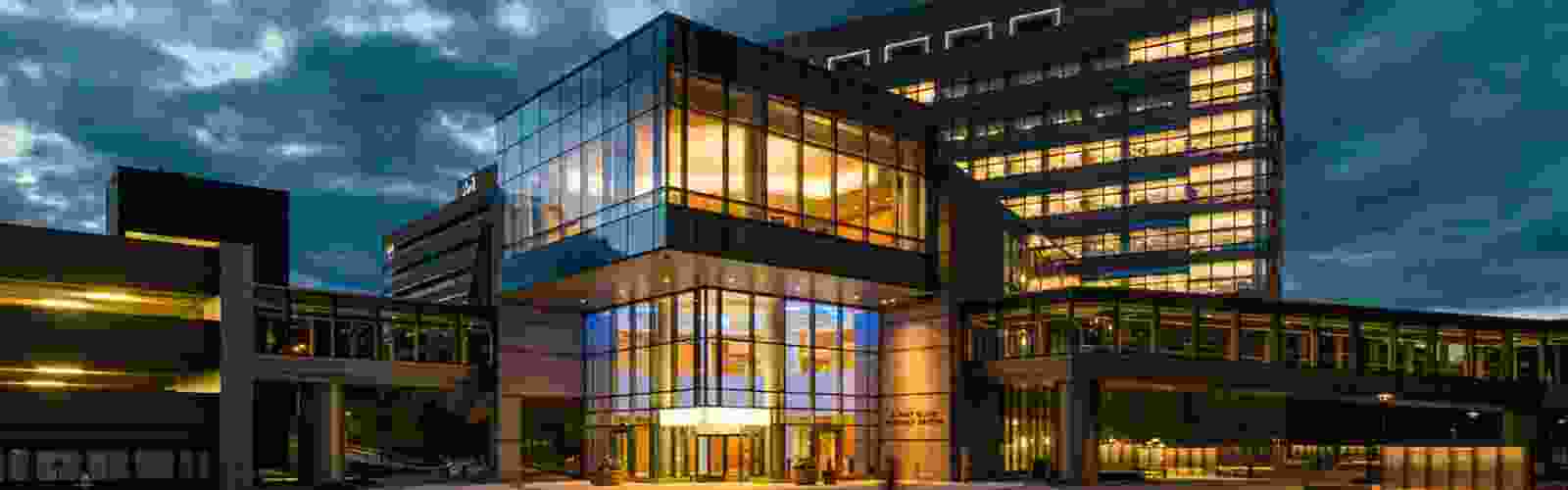 The UMass Chan Albert Sherman Center building with a vivid evening sky behind it