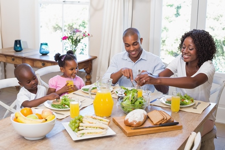 Happy Family enjoying a healthy meal at home