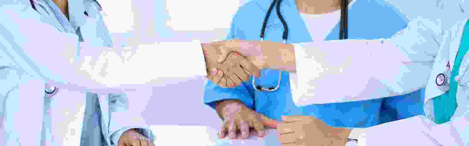 Two-Doctors-Shaking-Hands.png