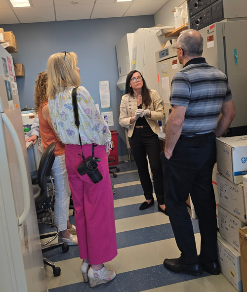 ALS lab tour guests speaking with Daryl Bosco, PhD, of Bosco Lab