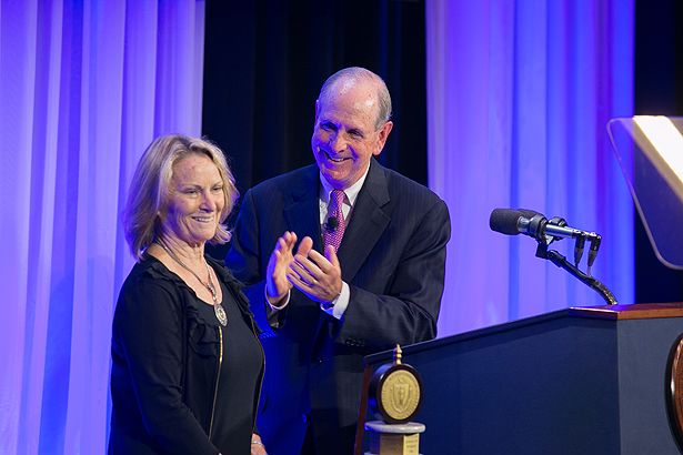 Chancellor Collins applauds Anne Gilroy, recipient of the Chancellor’s Medal for Distinguished Teaching.