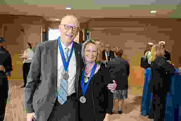 Chancellor’s Medal winners Michael Hirsh and Anne Gilroy share a moment.