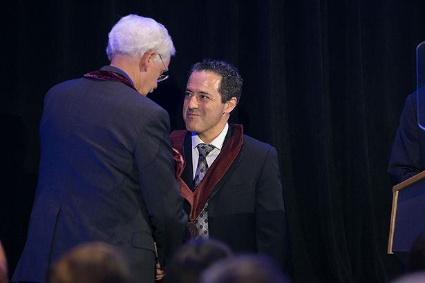 Brian Silver is congratulated by Robert H. Brown Jr. as Dr. Silver is invested as the inaugural recipient of The Endowed Chair in Neuroscience Research.
