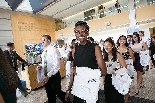 Anika Obasiolu and classmates line up to enter the White Coat Ceremony.