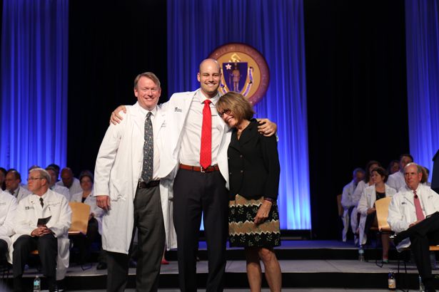 Caleb Noone (center) flanked by mentor Samuel Borden, MD, and his mother at the White Coat Ceremony