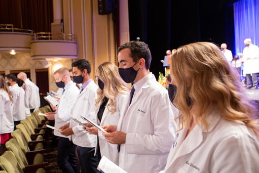 Second-year medical student Alex Richard joins the Class of 2024 in reciting the class oath.