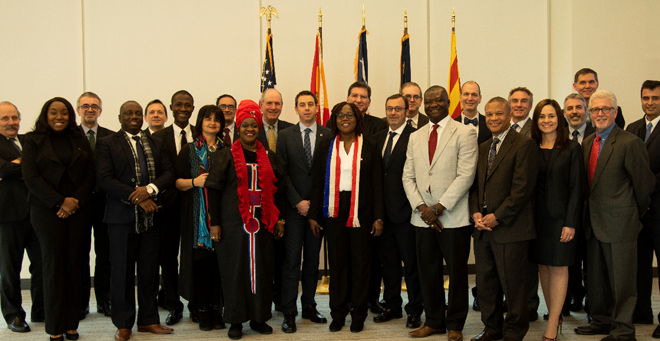 Chancellor Michael F. Collins is pictured with representatives from Grifols and Liberia at a celebration of an Ebola prevention initiative in which UMMS was a partner.