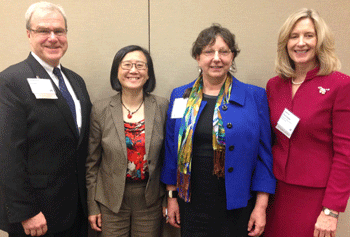 Mary Lee, MD, and Vivian Budnik, PhD, (center) were joined at by School of Medicine Dean Terence Flotte and Luanne Thorndyke, MD, at the ELAM graduation ceremonies in April. 