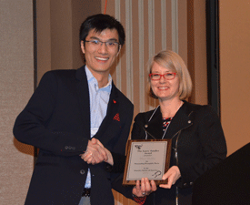 Zhao Zhang, PhD, receives the 2015 Larry Sandler award during the 56th Annual Drosophila Research Conference in March.