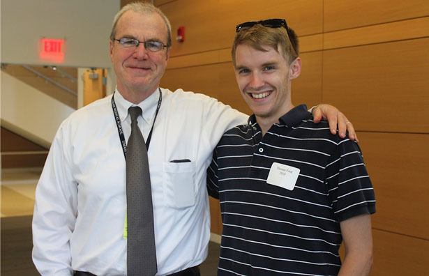 School of Medicine Dean Terence R.Flotte chats with Thomas Ford, a second-year student who attended the picnic to welcome the Class of 2019.