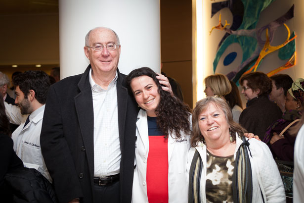 School of Medicine student Elizabeth Rosen shares a hug with her proud parents after taking the Second Year Oath.