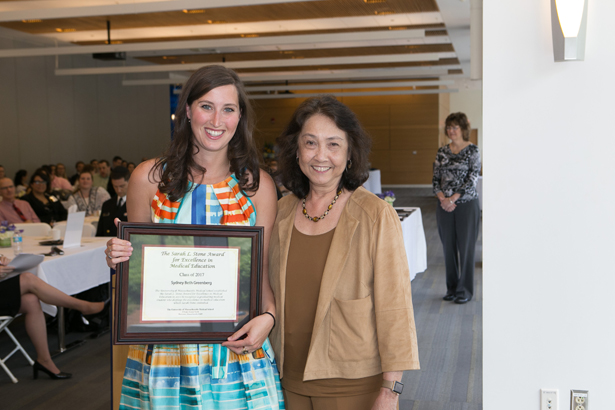 Sydney Greenberg accepts the Sarah L. Stone Award for Excellence in Medical Education from Mai-Lan Rogoff, MD.