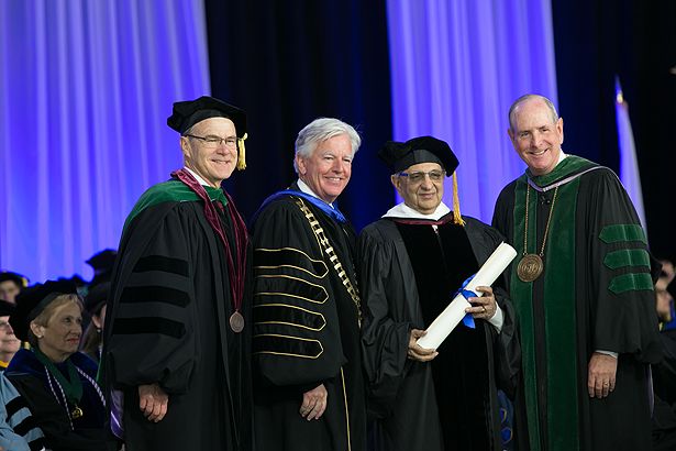 (from left) Terence Flotte, Marty Meehan, honorary degree recipient Cyrus Poonawalla and Chancellor Collins
