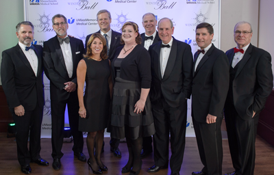 First row from right to left:  UMass Medical School Dean Terence R. Flotte; UMass Memorial Medical Center President Patrick Muldoon; Chancellor Michael F. Collins; Kate McEvoy-Zdonczyk, 2017 Winter Ball co-chair and vice president for Central and Western Massachusetts for Harvard Pilgrim Health Care; Lt. Gov. Karyn Polito Second row right to left: UMass Memorial Health Care CEO and President Eric Dickson; Gov. Charlie Baker; Eric Schultz, 2017 Winter Ball co-chair and president and CEO of Harvard Pilgrim Health Care; and 2017 Winter Ball Co-chair Michael V. O'Brien, executive vice president of WinnCompanies.