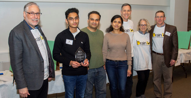 2020 Central Massachusetts Brain Bee winner Tej Patel (second from left) is pictured with (from left) Sheldon Benjamin, MD; his parents; Michael and Shirley Sheridan; and David Weaver, PhD.