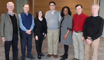Newly appointed director of the high-resolution cryo electron microscopy facility at UMMS, Chen Xu, PhD (center) is pictured at a welcome reception with (from left) C. Robert Matthews, PhD; George Witman, PhD; Celia Schiffer, PhD; Jean King, PhD; Andrei Korostelev, PhD; and Roger Craig, PhD.