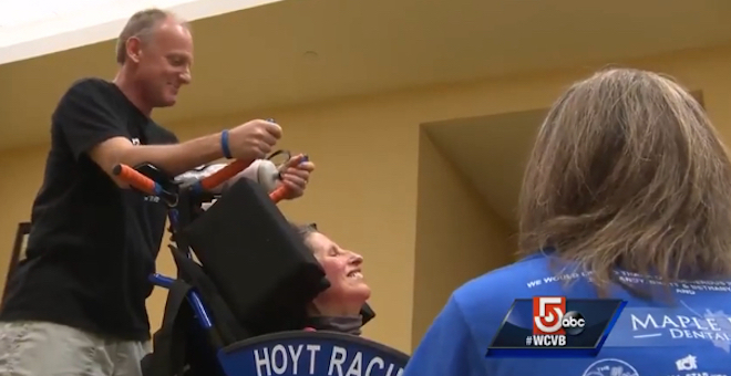 Chris Benyo and Denise DiMarzo speak with a WCVB reporter after receiving a new Team Hoyt running chair for Denise in time for the 2016 Boston Marathon.