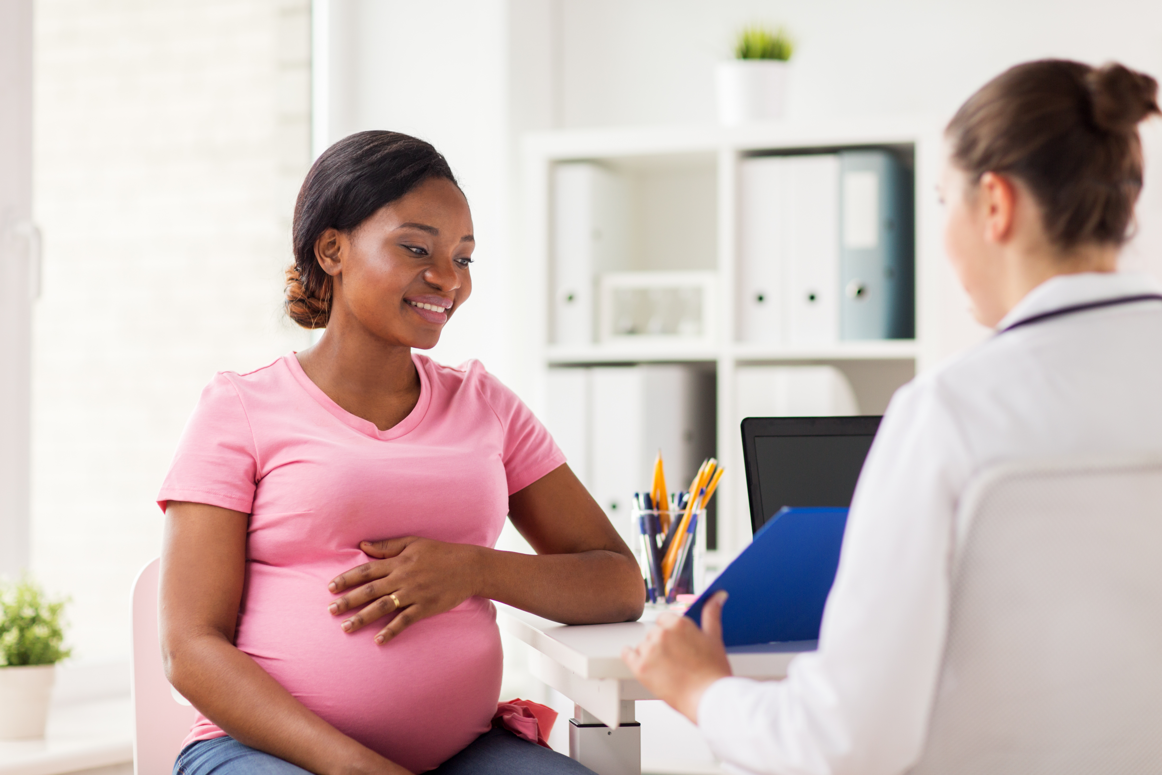 provider offering counseling to pregnant patient